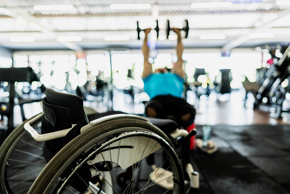 Man in wheelchair working out