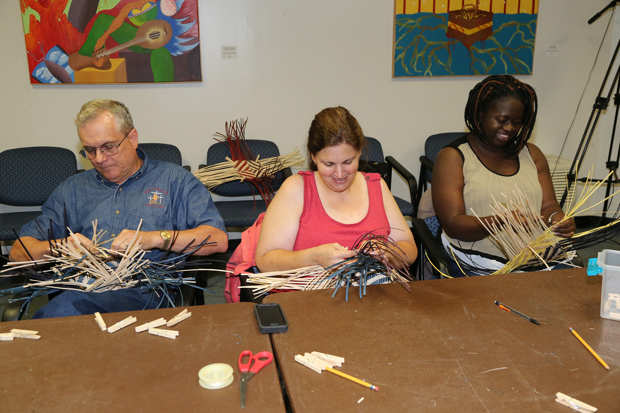 A group participates in a craft workshop