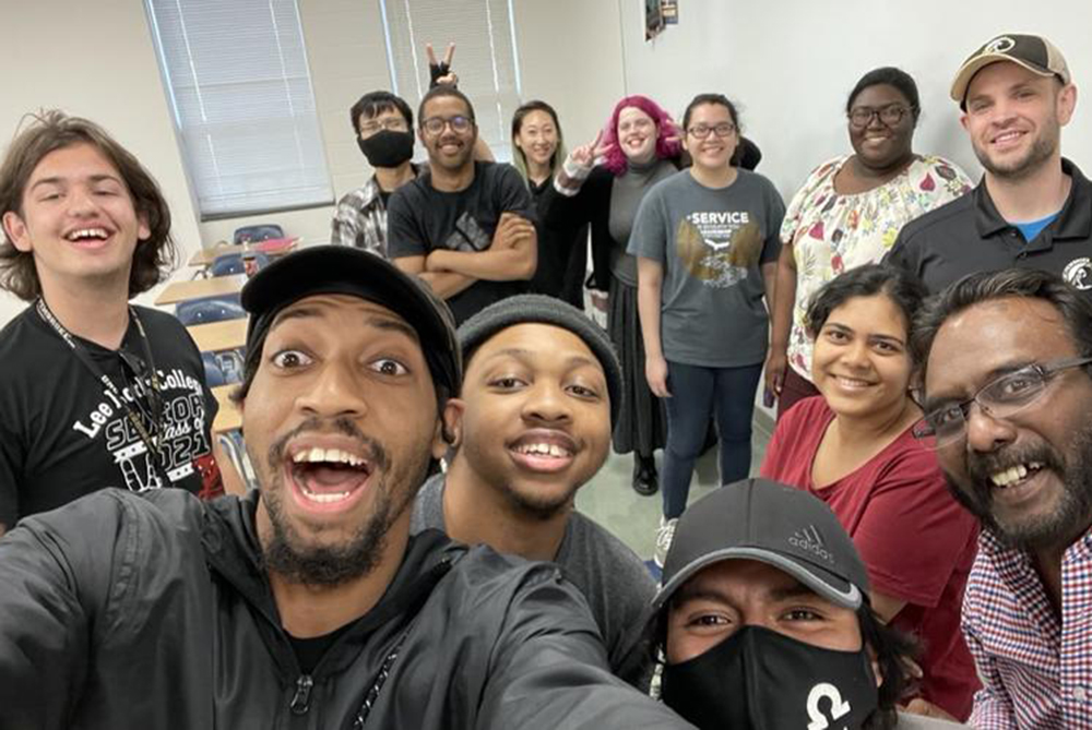 Large diverse group of students in the Associatoin for Computer Machinery at UNC Pembroke taking a selfie together.