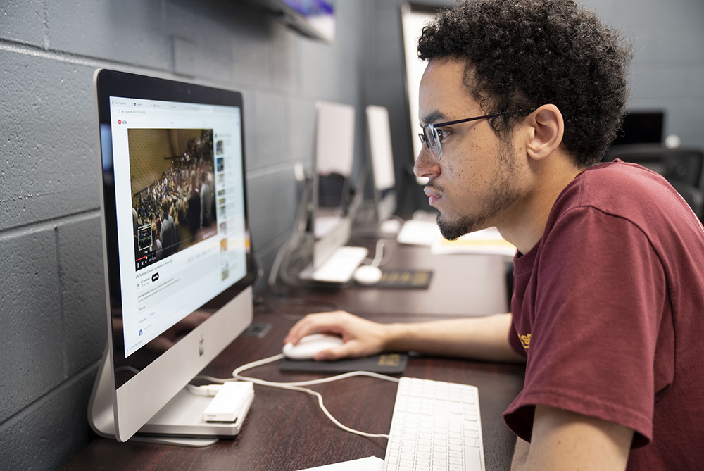 comm student at laptop