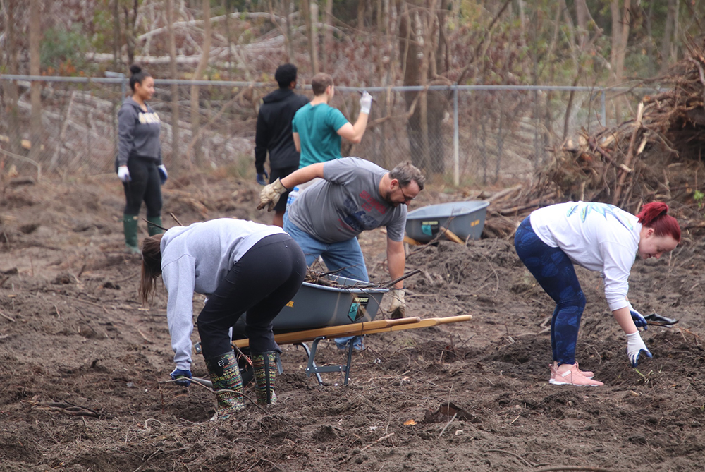 Greener Coalition club cleaning up outside
