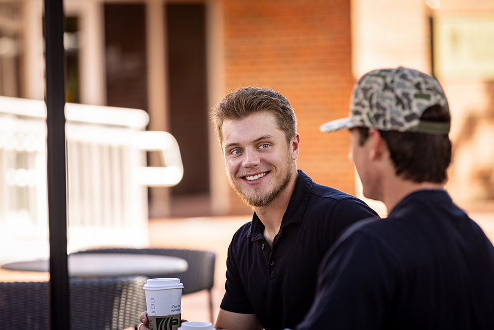 two male students on UNCP campus