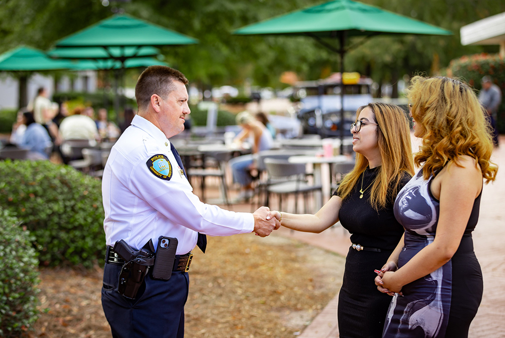 police with students on UNCP campus
