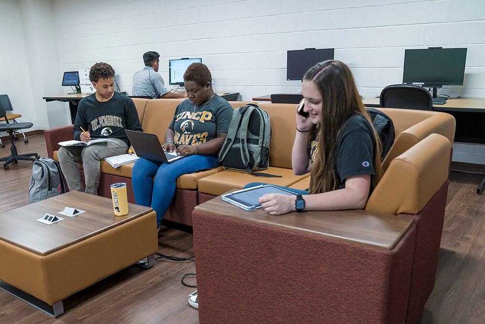 UNCP students in a residence hall study room
