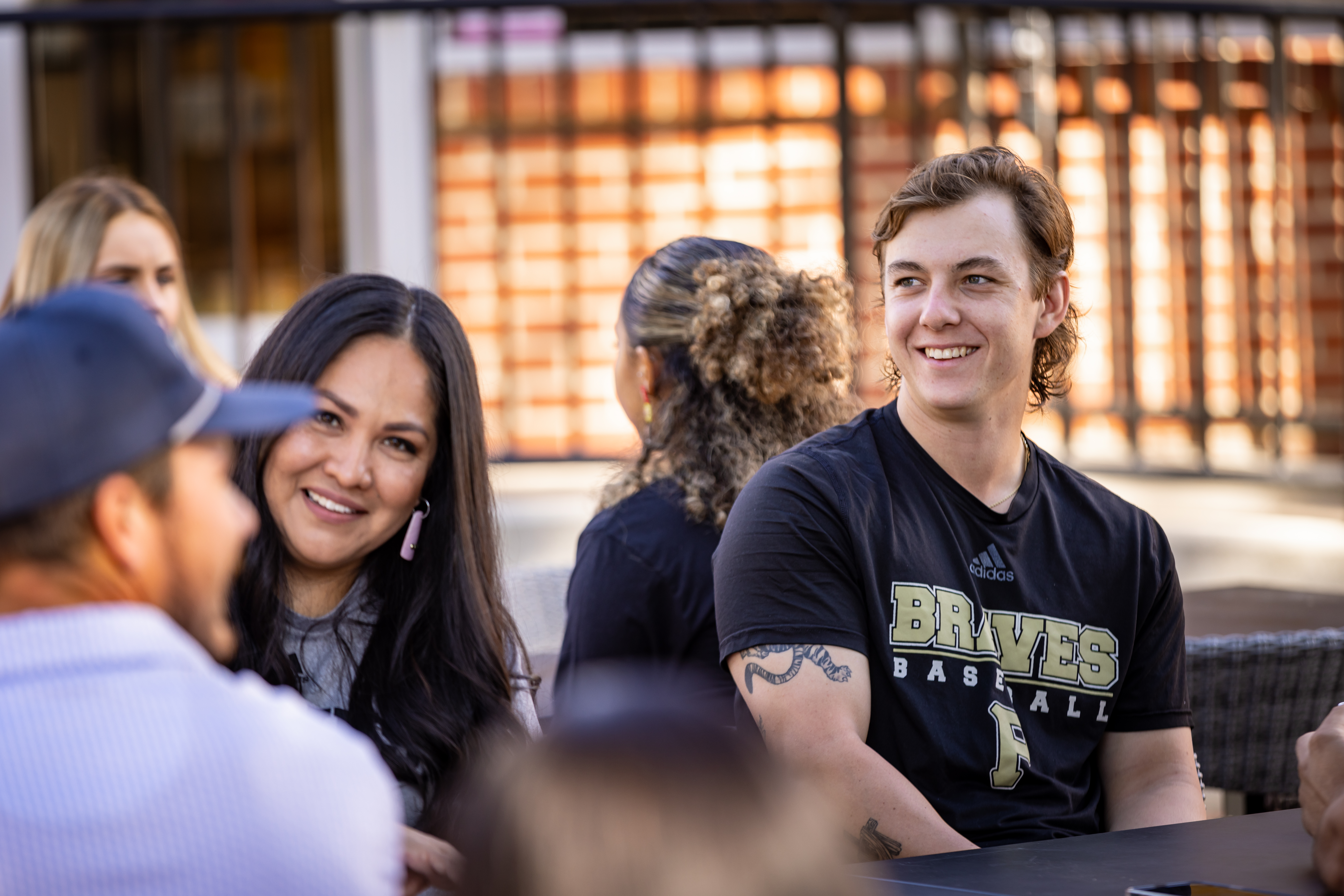 UNCP students sitting outside talking