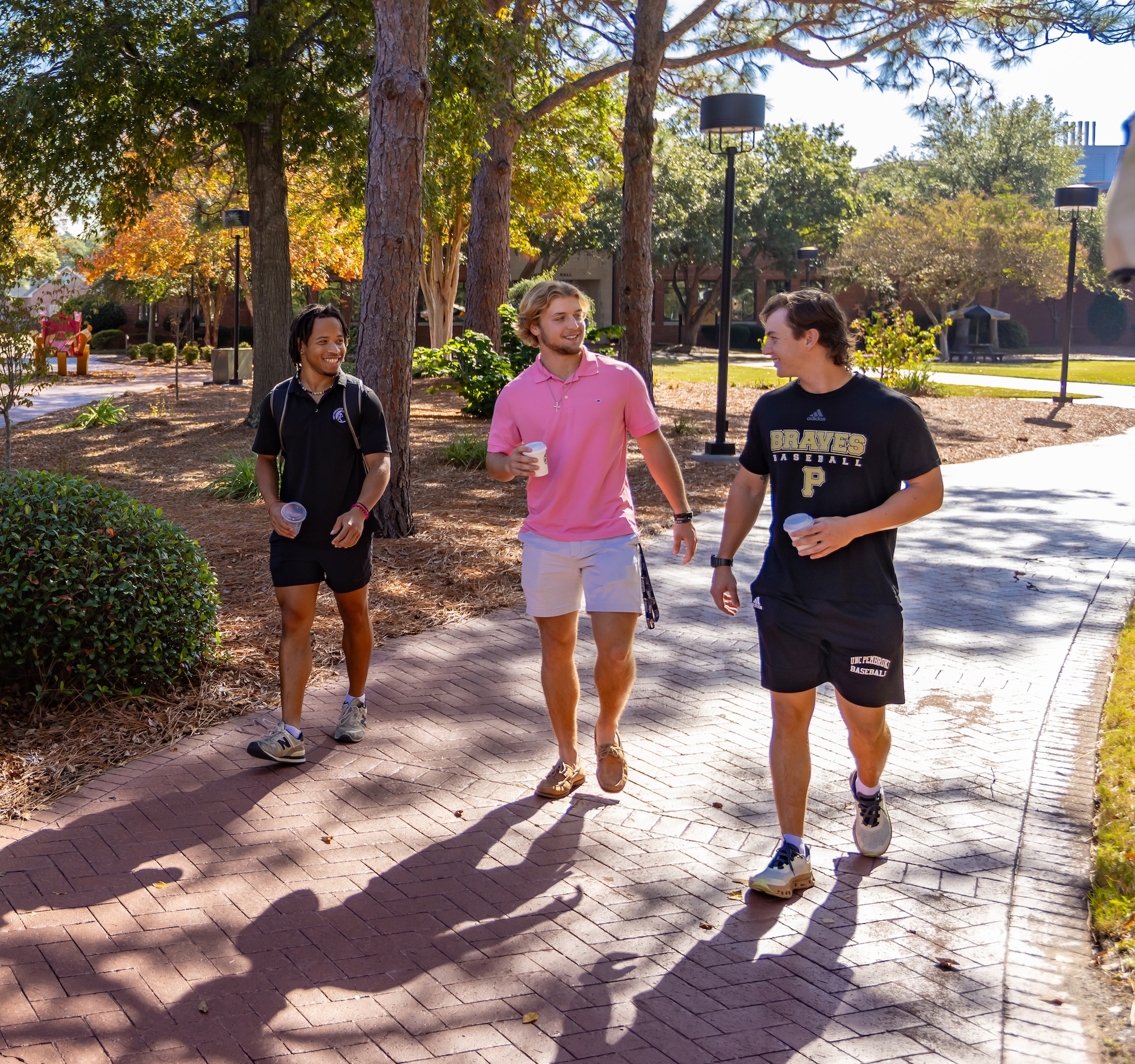 group of students walking on UNC Pembroke campus