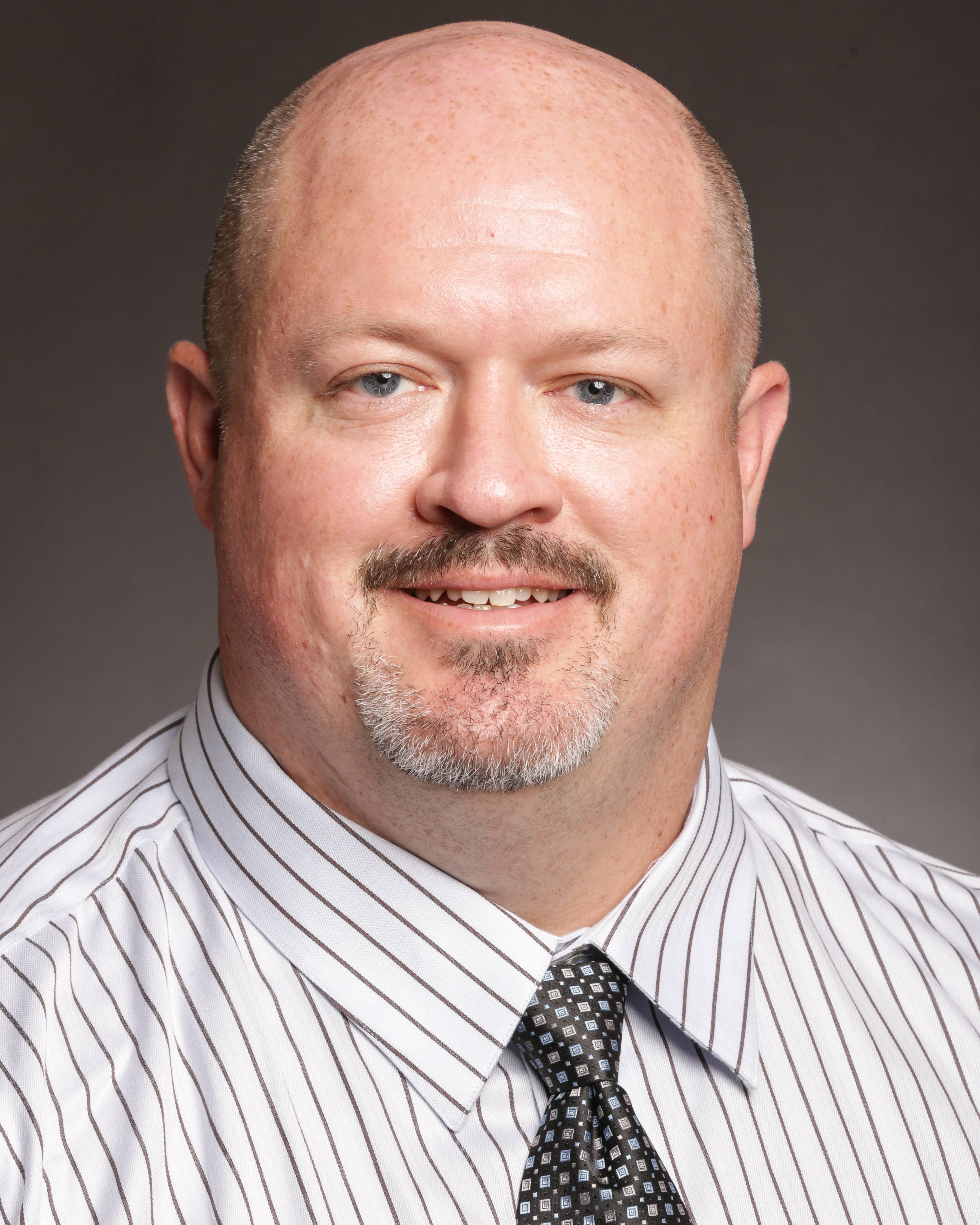 headshot of Adam Walls