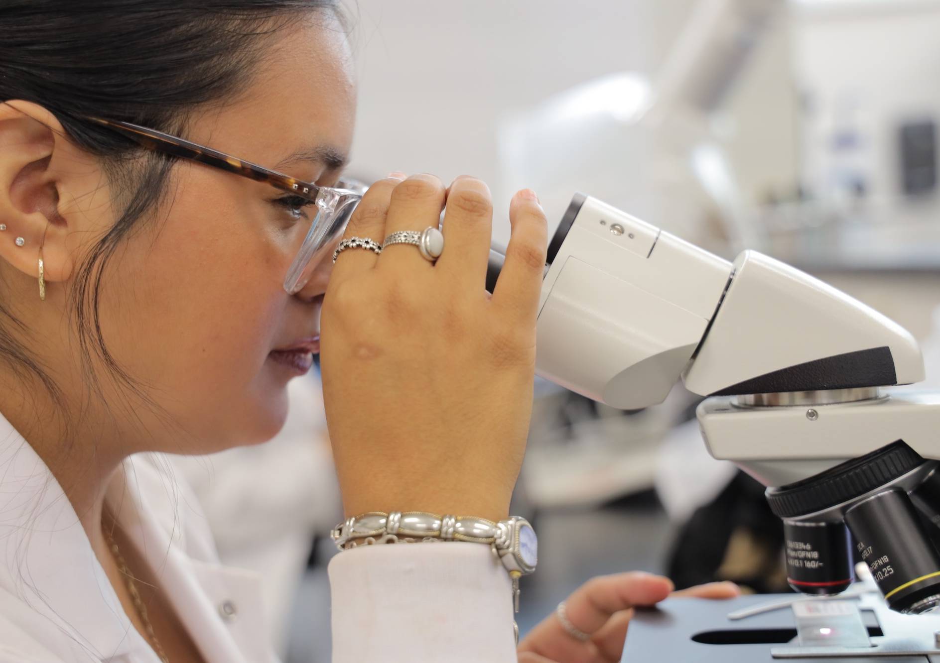 UNCP student looking in a microscope