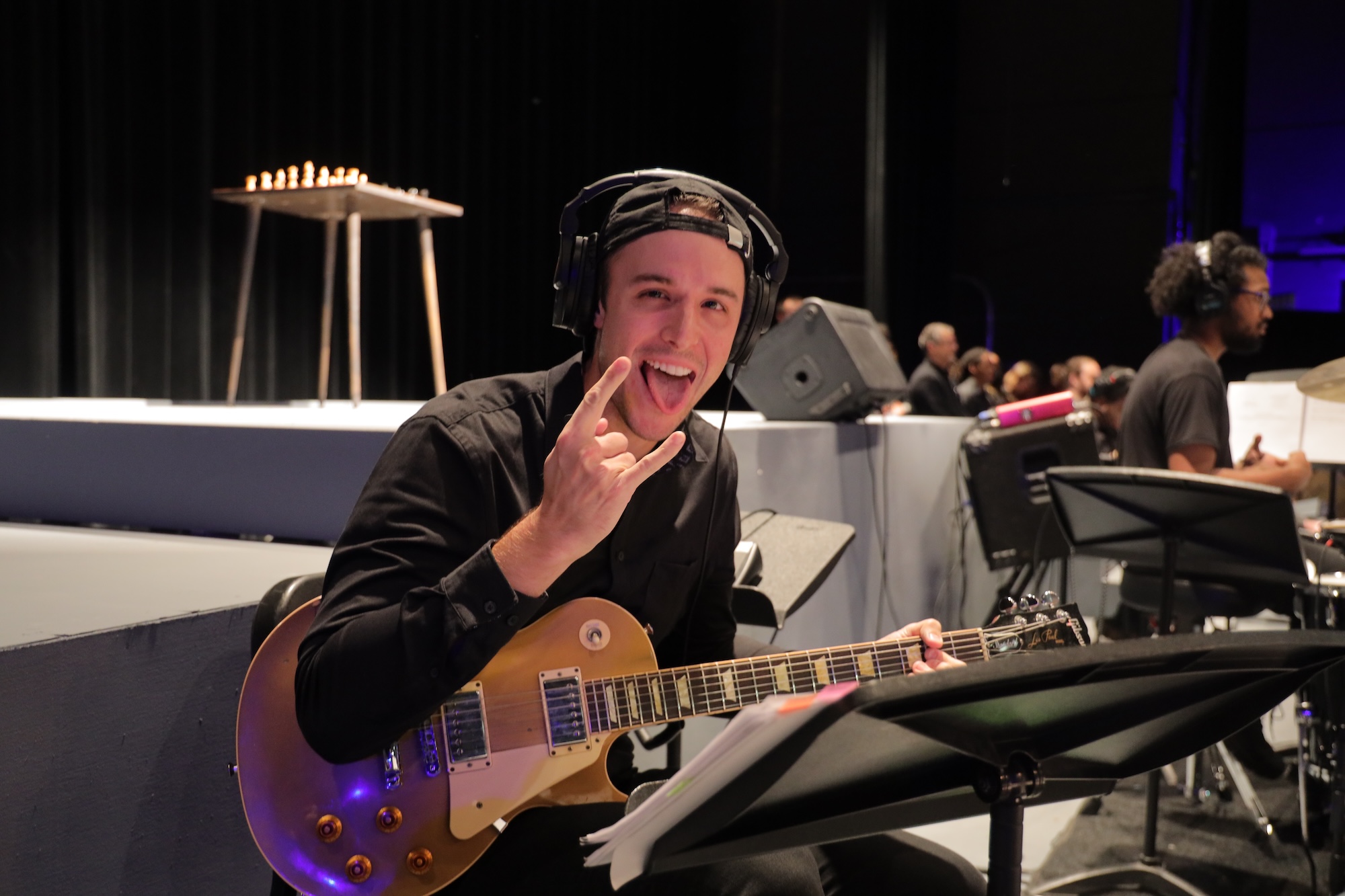 student rocks out with guitar