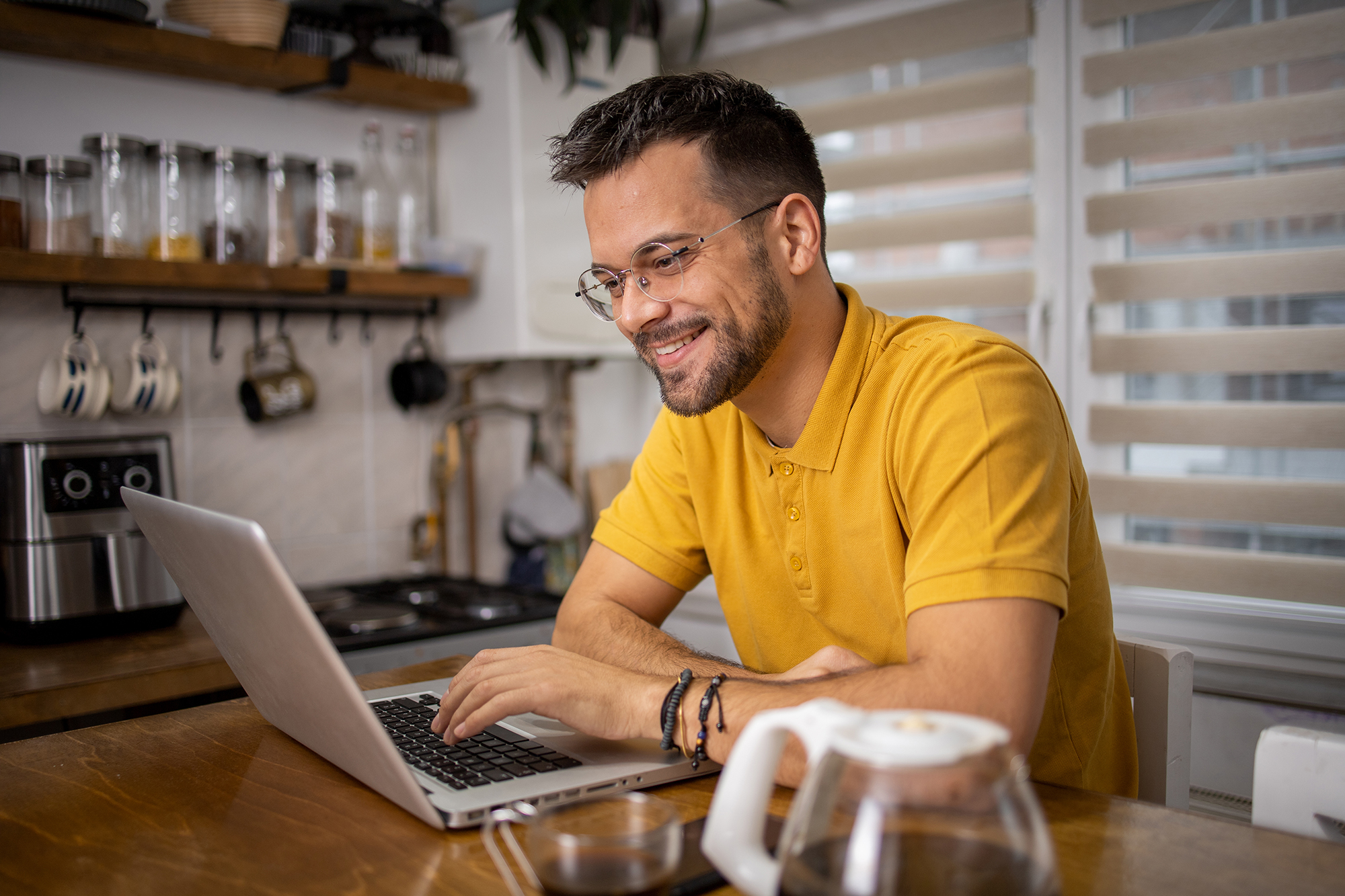  student wearing headphones sitting at a laptop