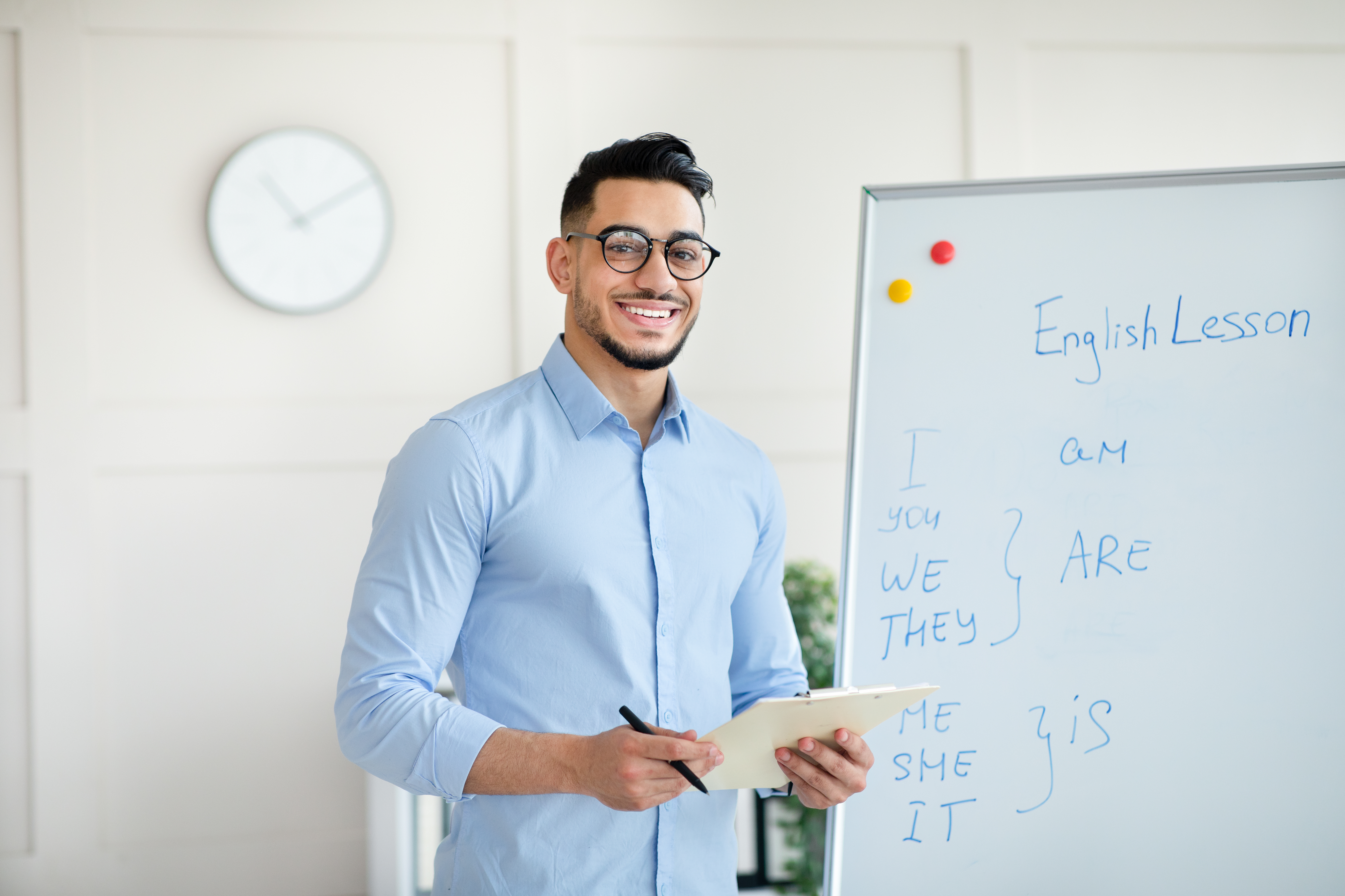 An english teacher writing on a white board