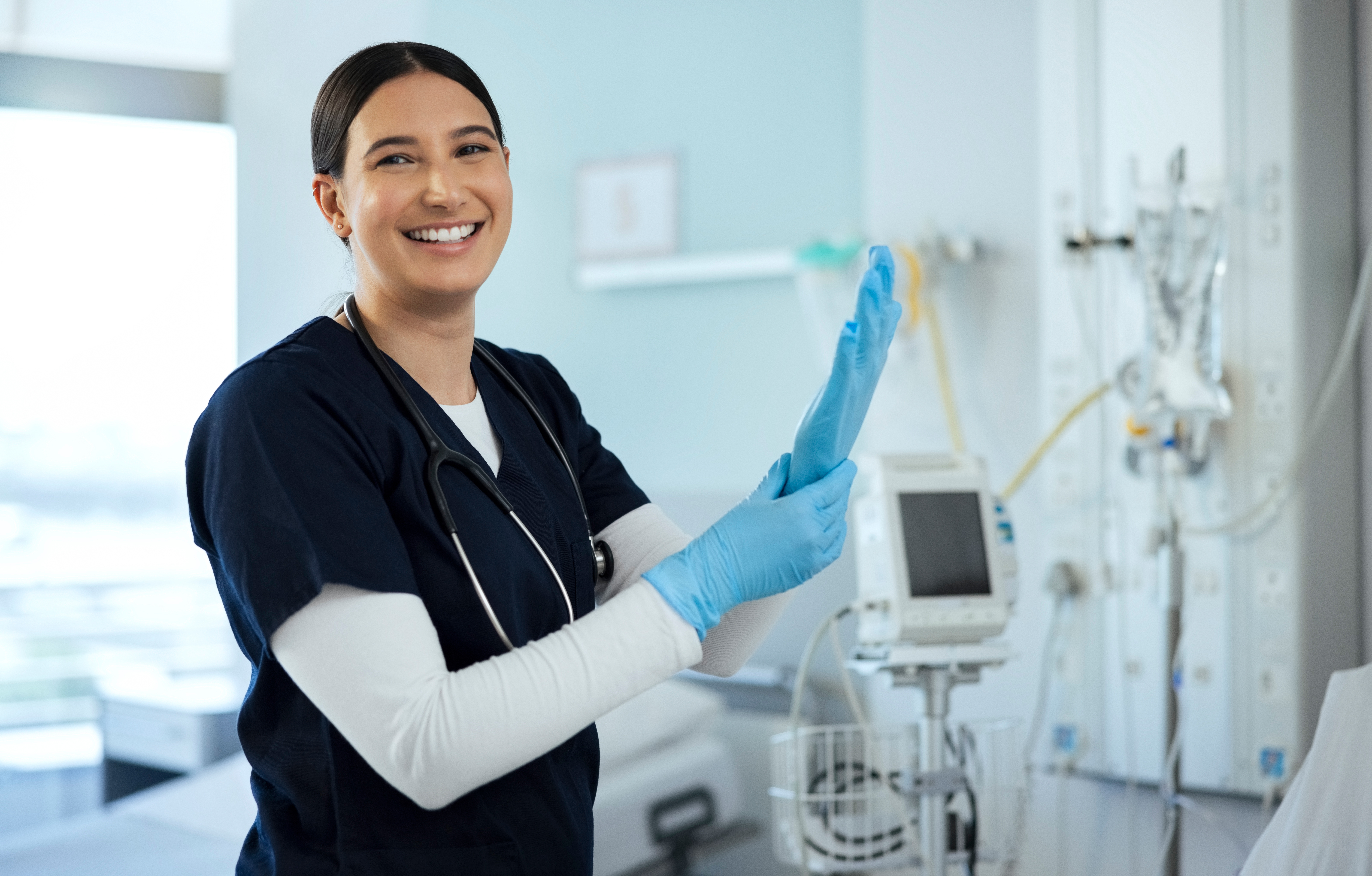Nurse smiling while holding a clipboard