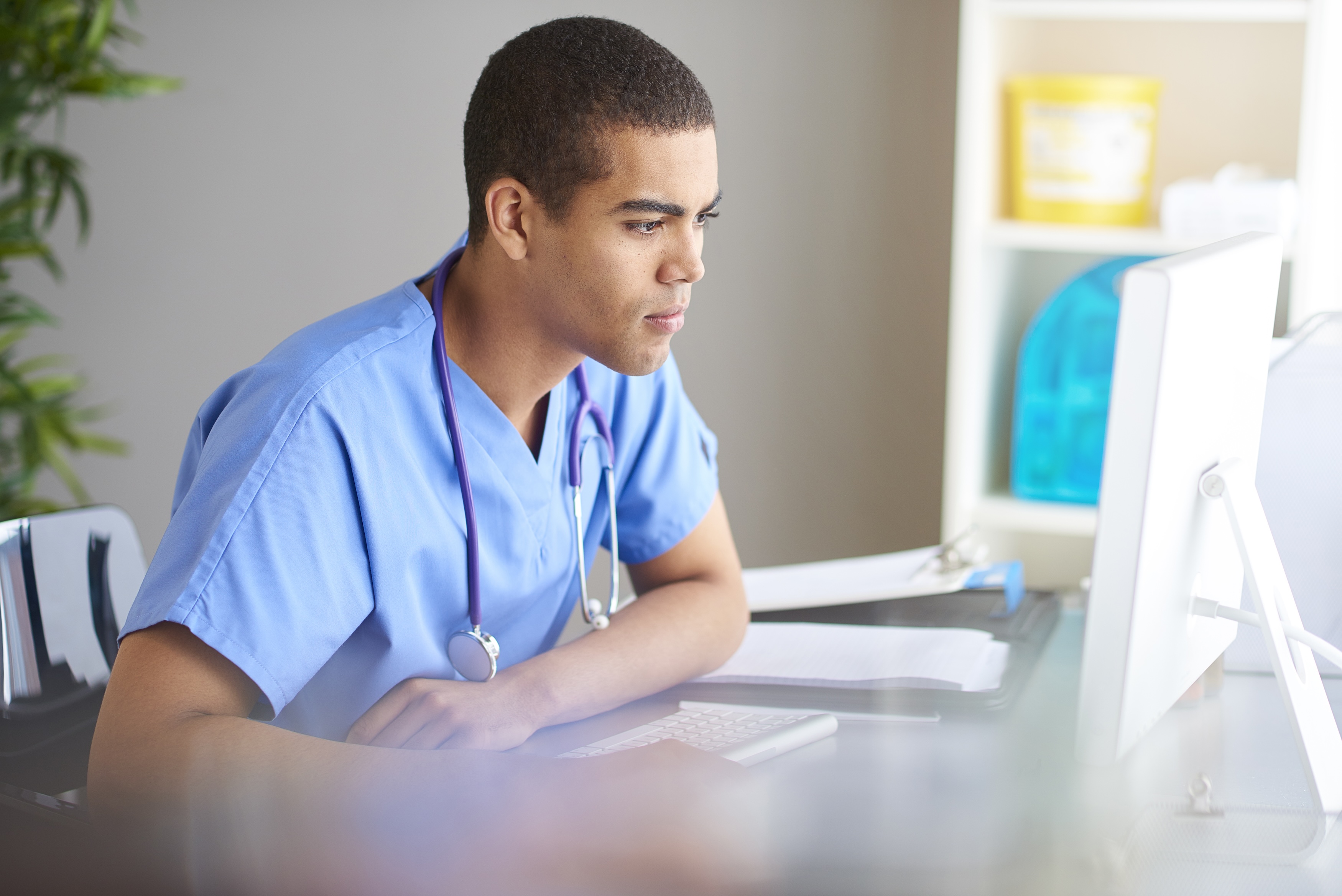 Nursing male on computer
