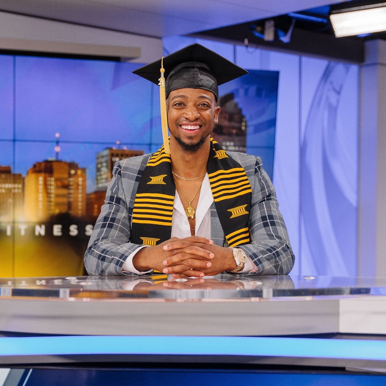 Samuel Shelton on the set of ABC News wearing his graduation cap