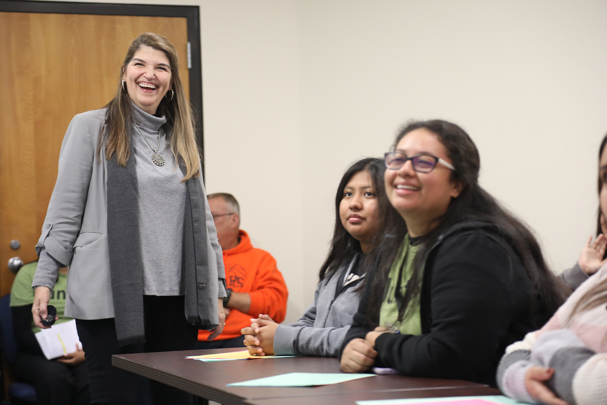 UNCP Spanish teacher laughing with students
