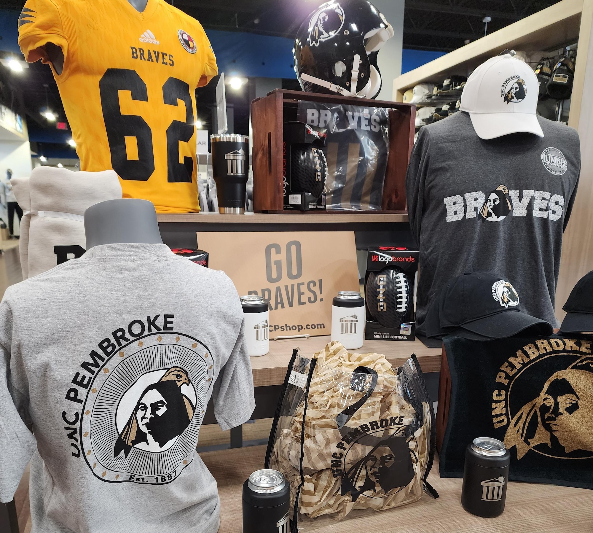 A collection of branded UNCP merchandise and materials, representing the university's licensing program.