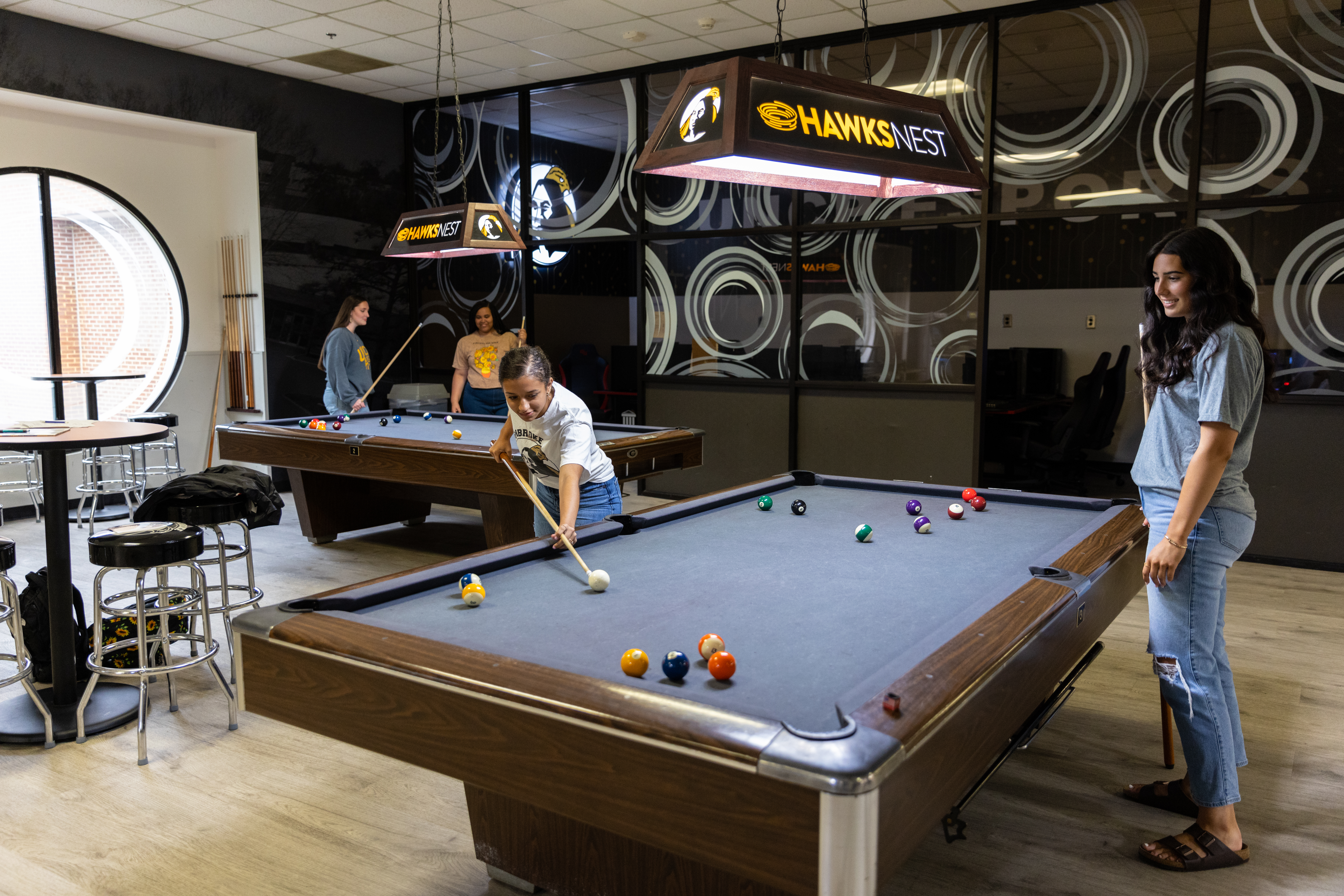 UNCP students playing pool in the Hawks Nest