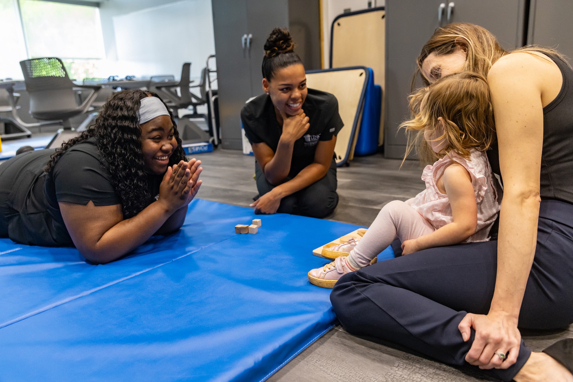 Occupational therapy students with child in class