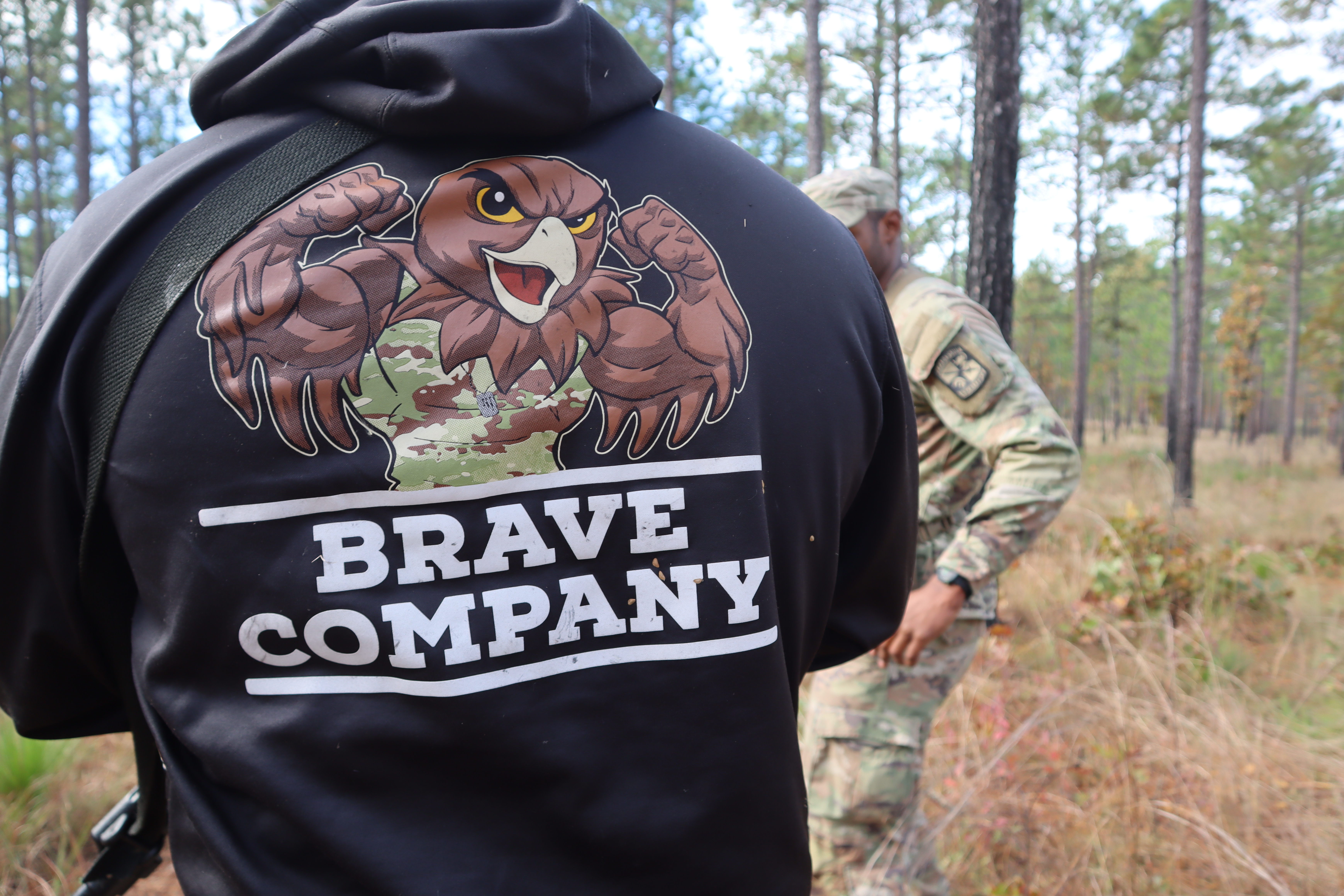 Back of ROTC hoodie in the woods UNCP