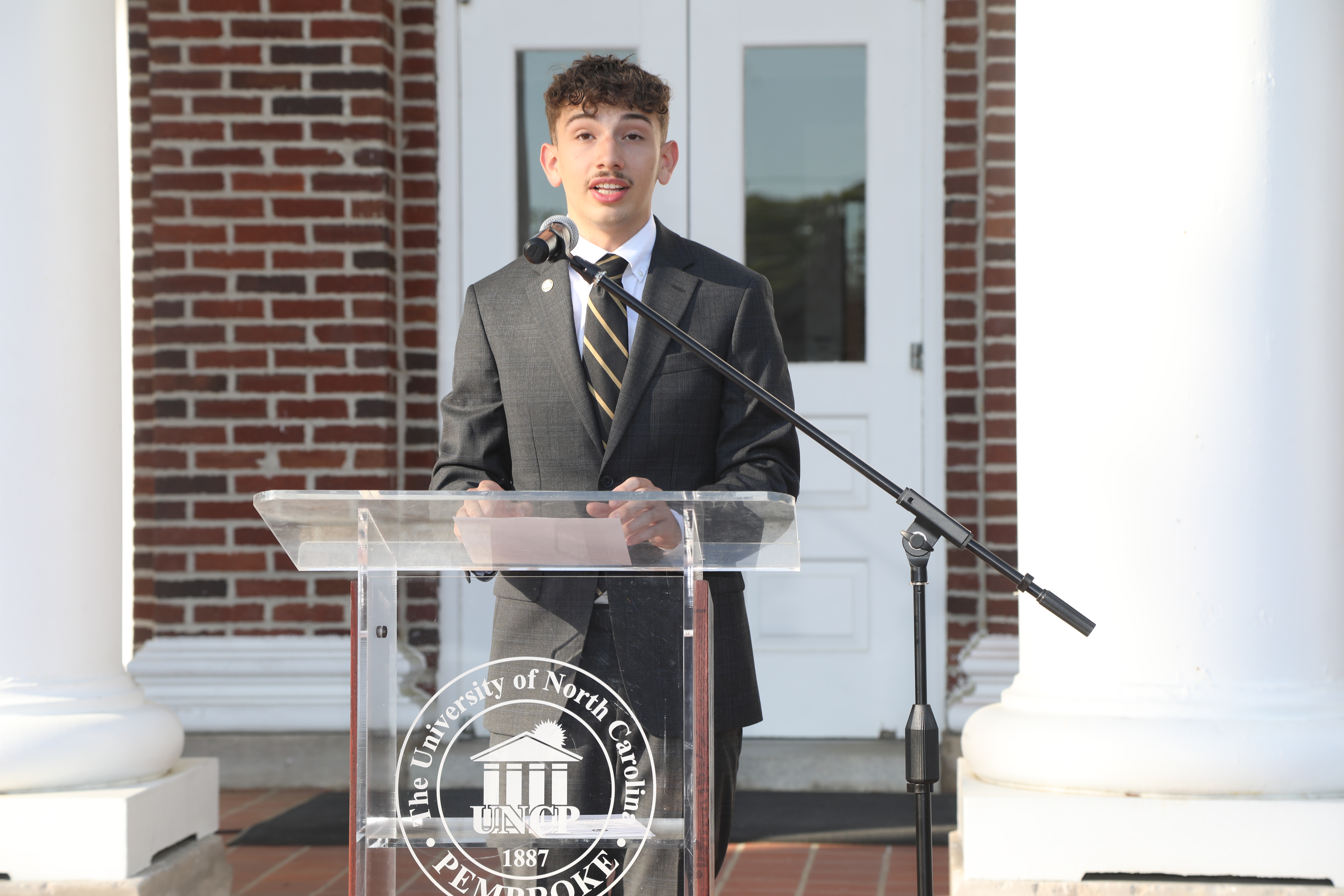 SGA President Speaking at Podium