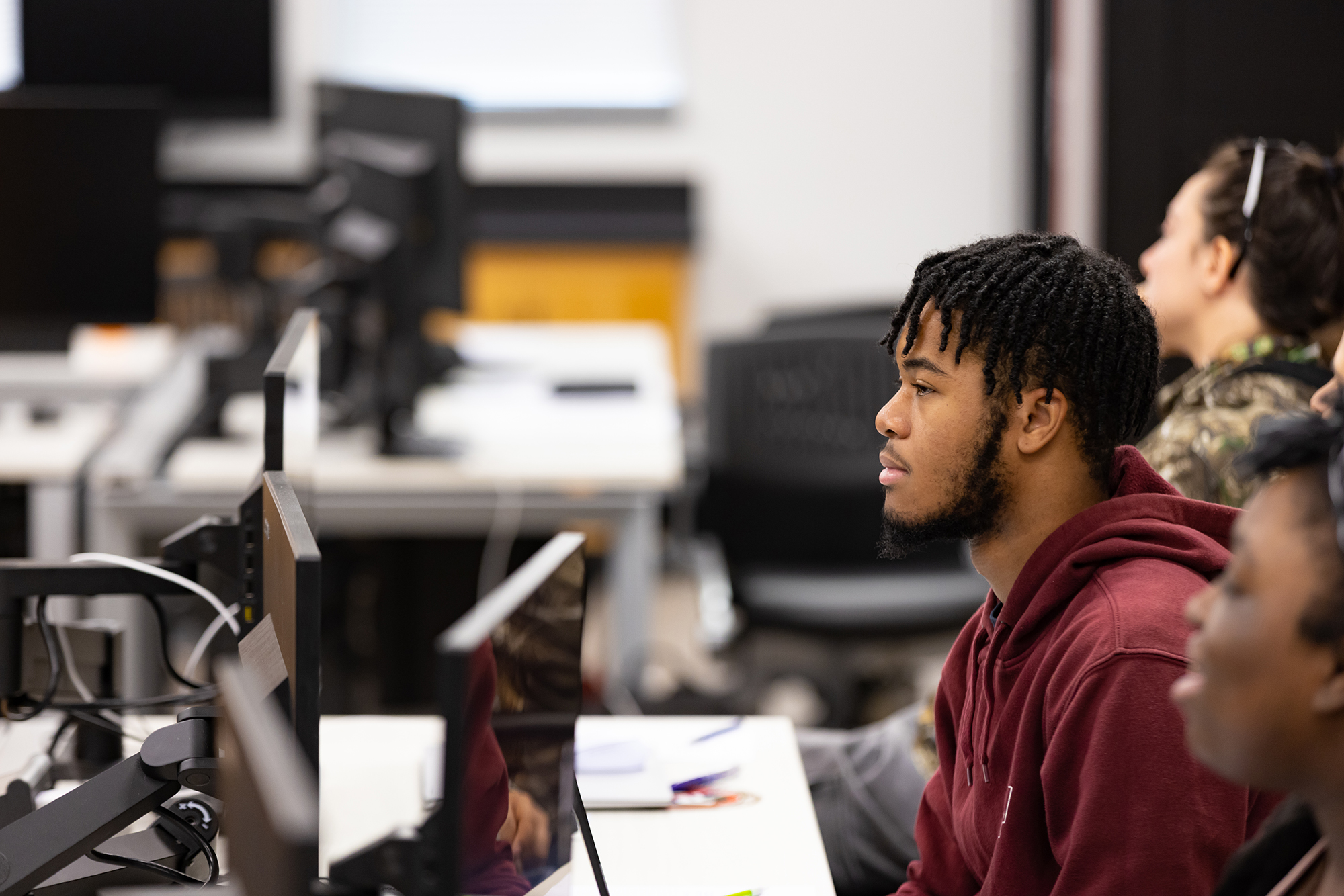 male student in UNCP computer lab