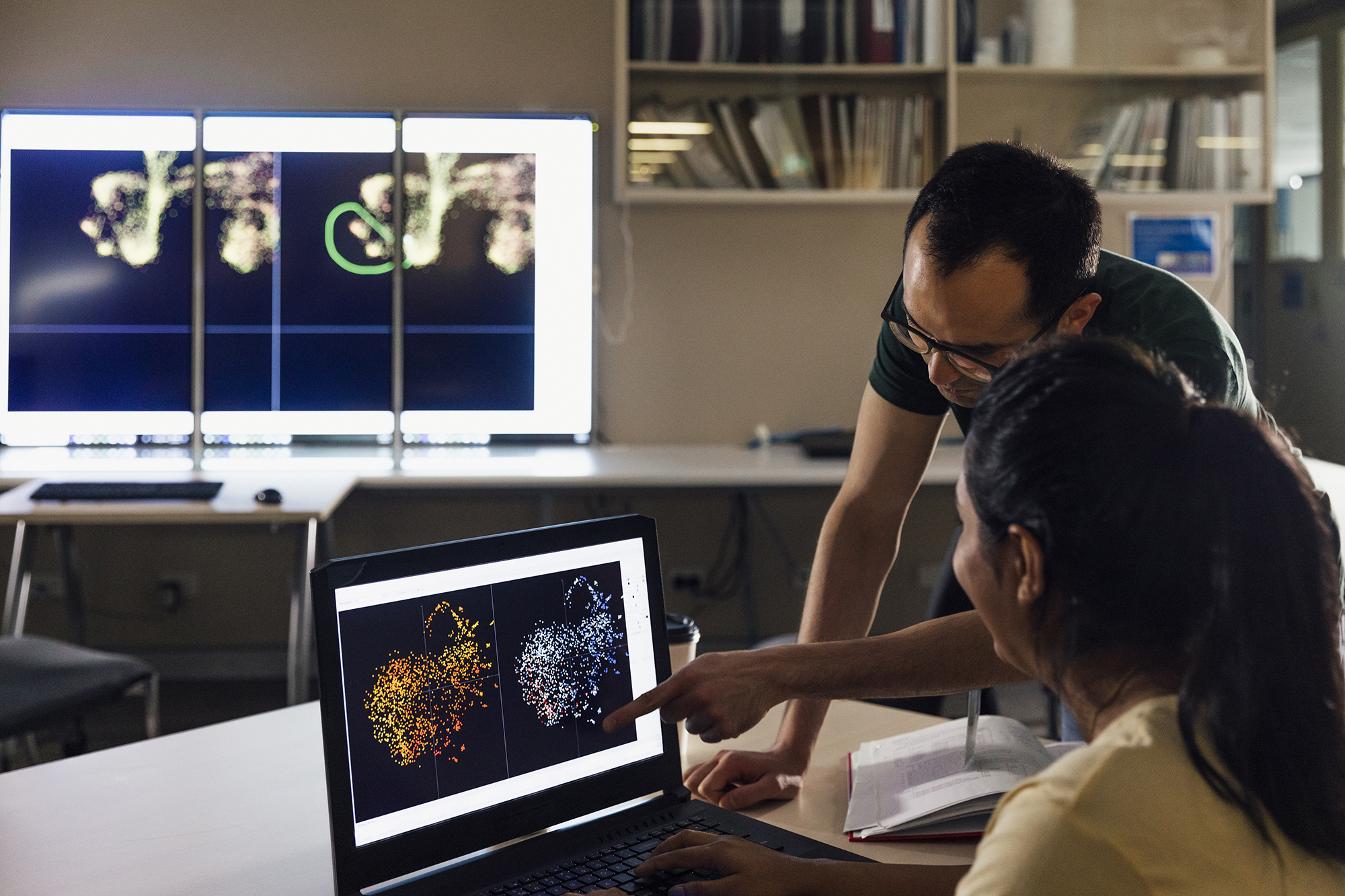 male teacher and female student study physics on a computer screen