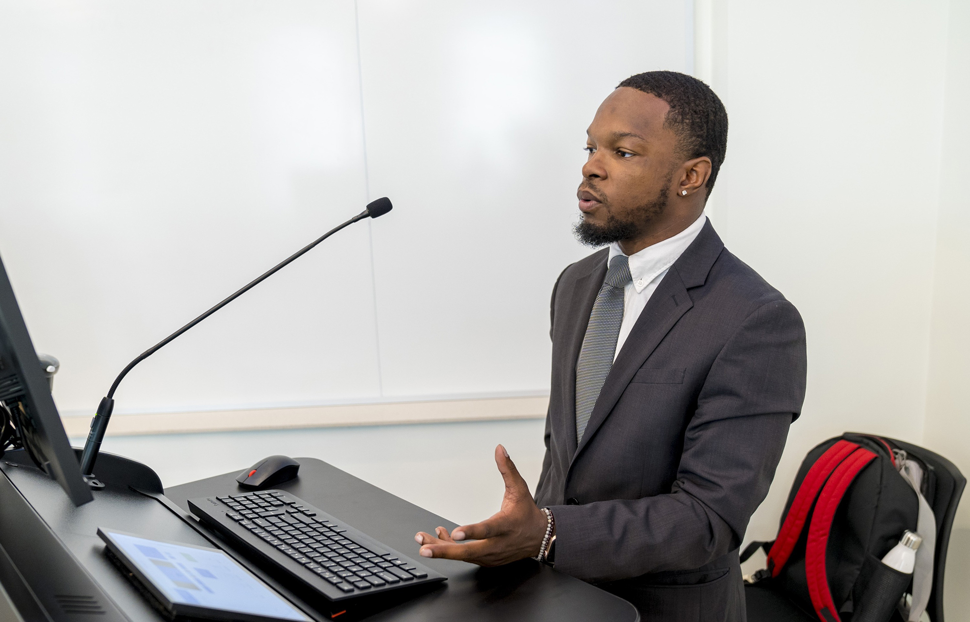 Student giving presentation at a podium