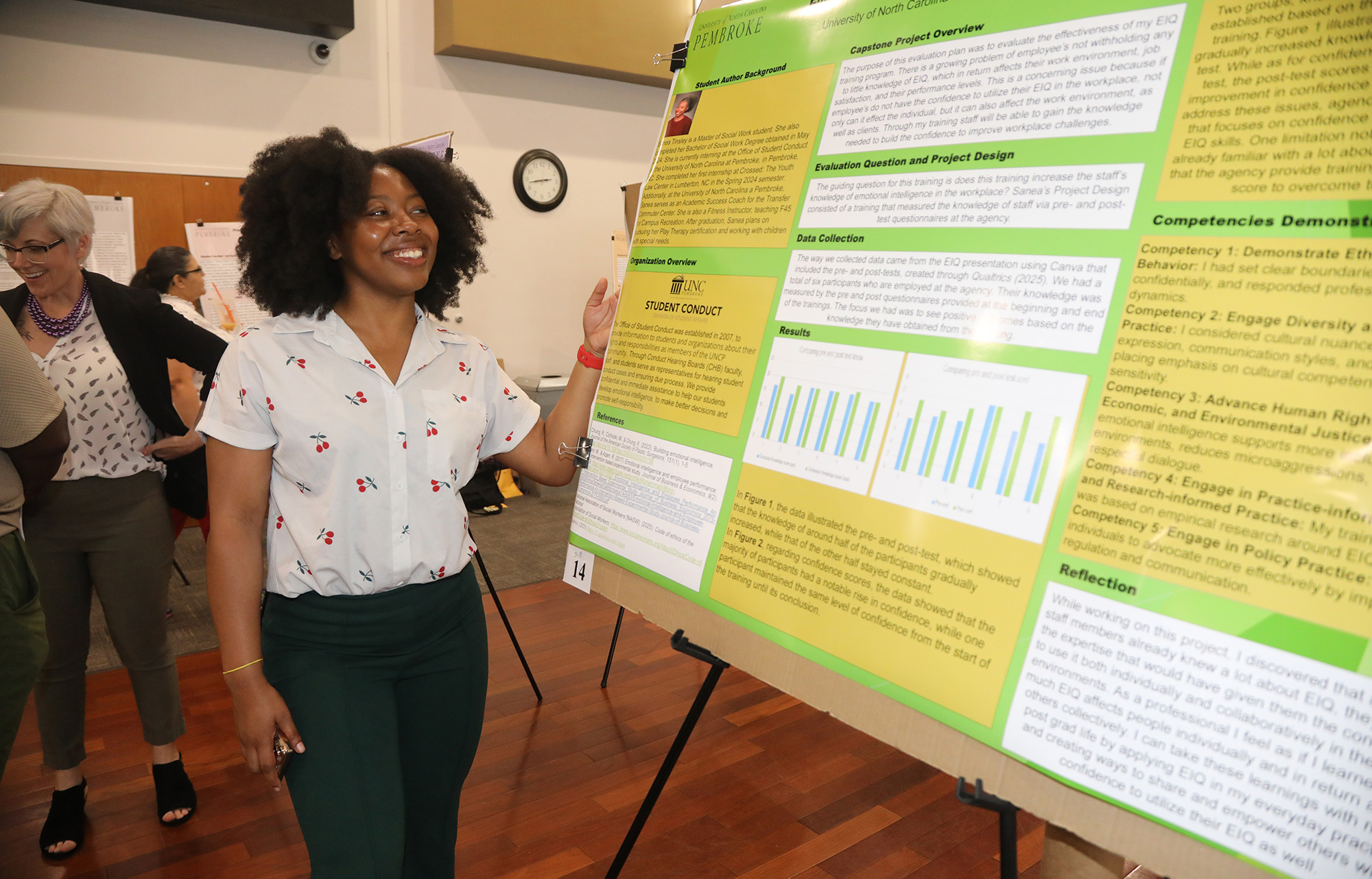 Student presents a poster in a symposium at UNC Pembroke.