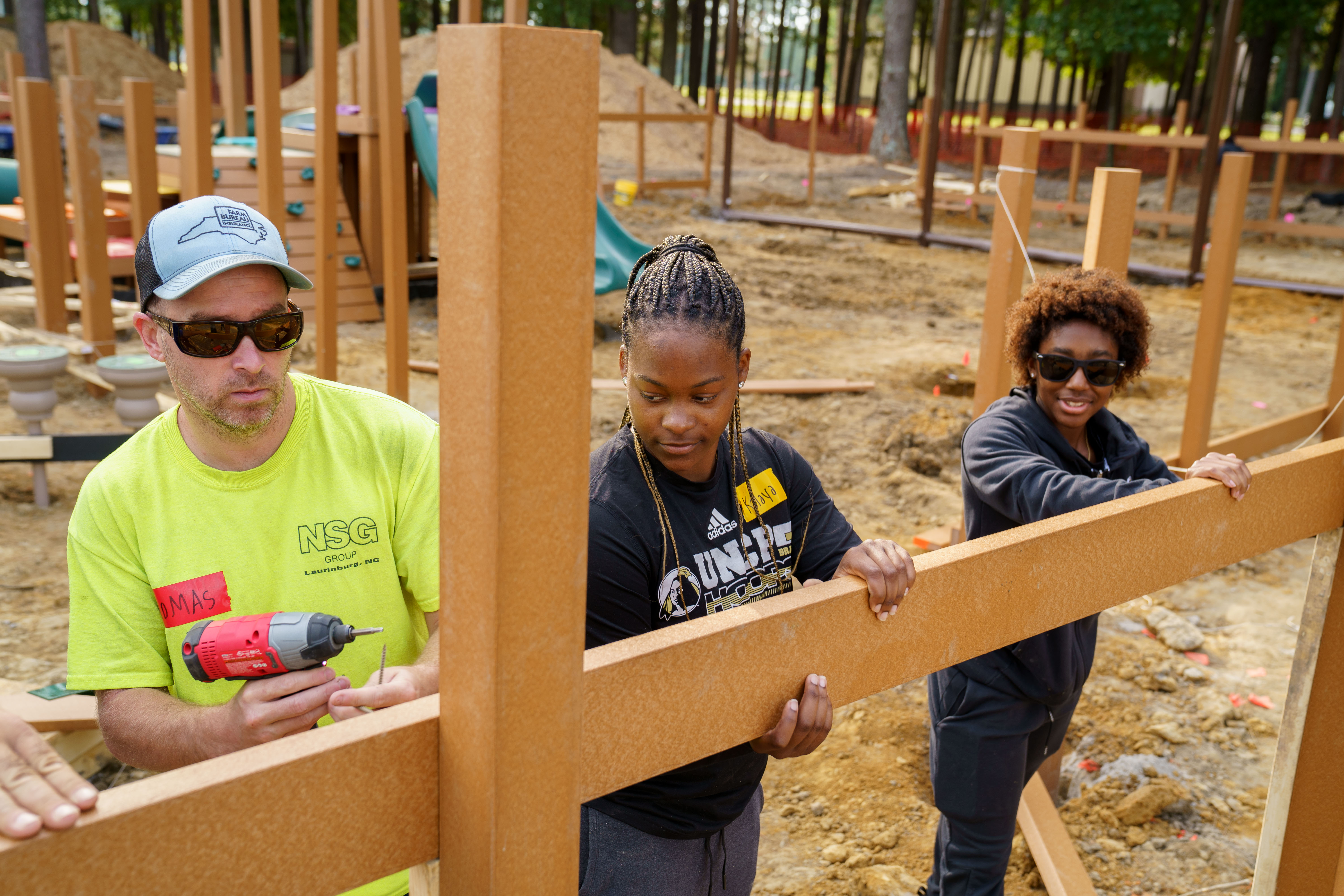 UNCP students working with community members to build a park