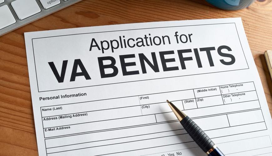 VA benefits application form on table