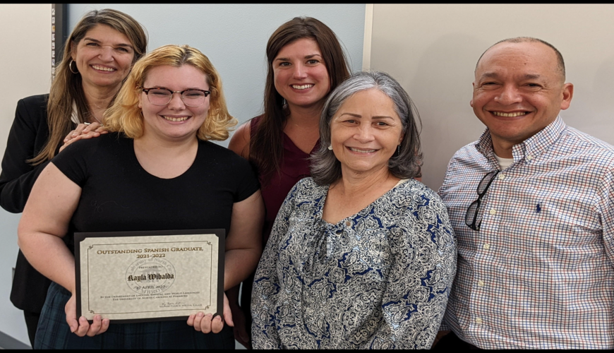 World Languages Faculty pose for a picture with Kayla Wibalda, the Outstanding Spanish Graduate for 2021-2022.