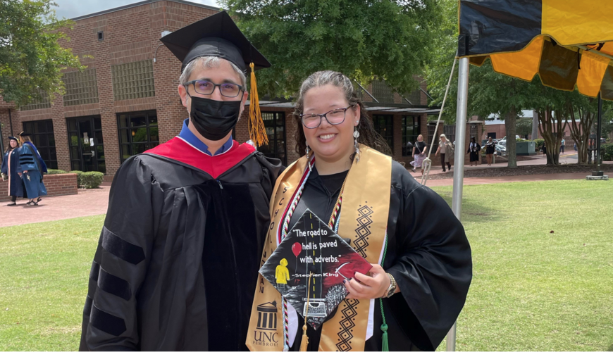 Dr. Peter Grimes (left) poses for a photo with ETWL graduate Lakota Craft.