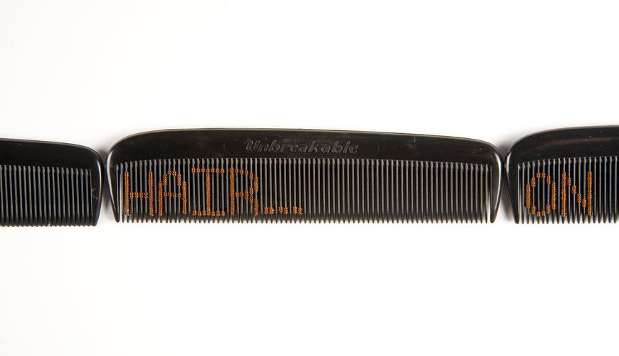 comb with the word hair embroidered