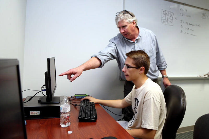 Professor Pointing at Computer Screen