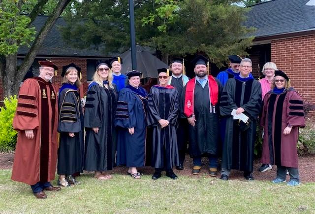 History Department faculty with two of the Spring 2022 graduates