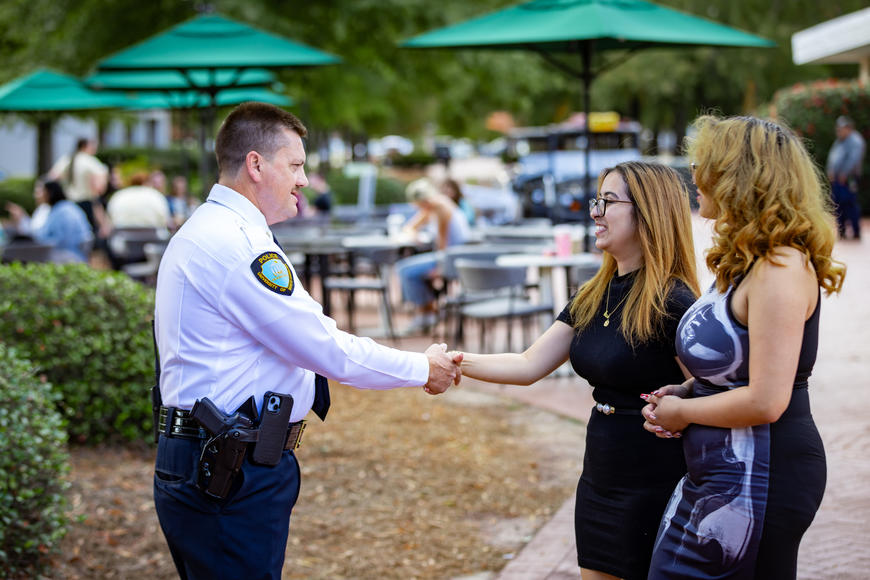 Assistant Chief greeting students around campus