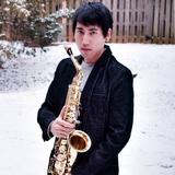 Image of Mr. Azuma holding a saxophone.