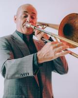 Image of Mr. Burge playing a trombone.