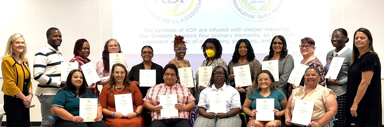 Fall 2023 KDP Initiates with Drs. Aiken (left) and Ficklin.
