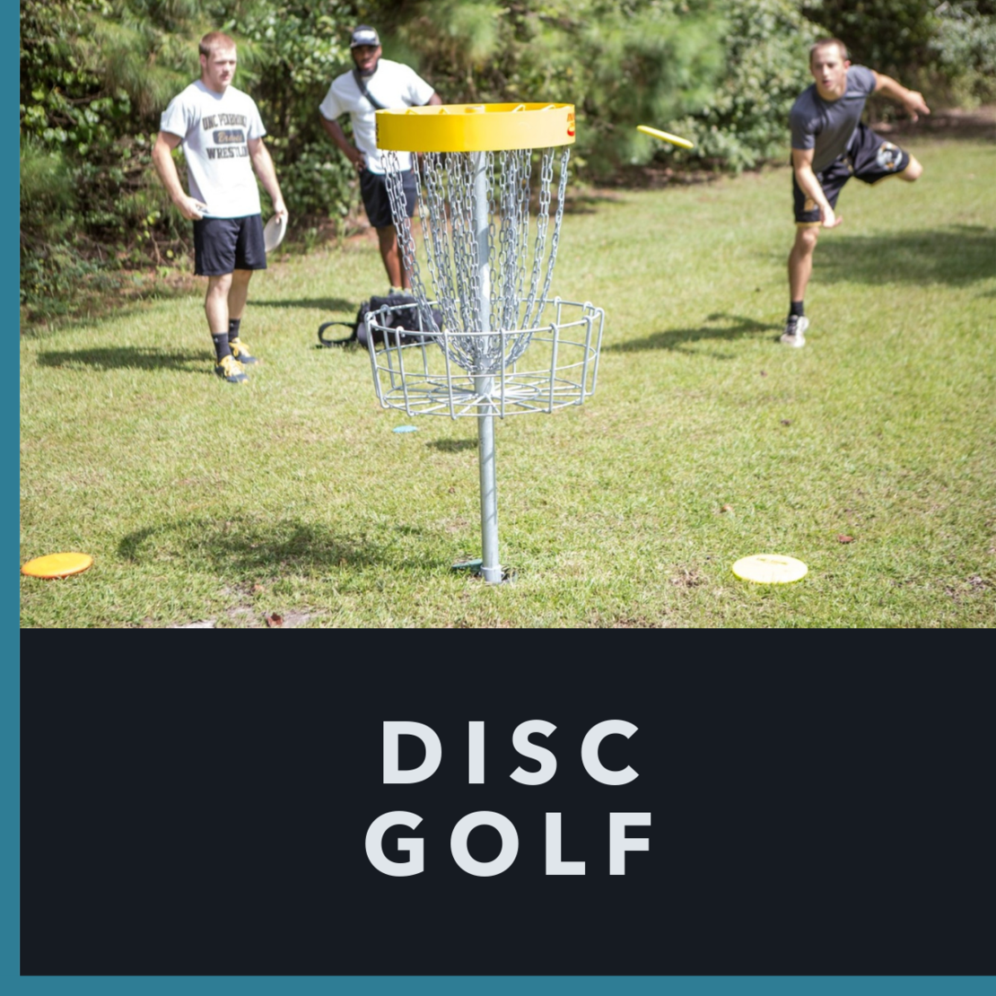 Students playing disc golf