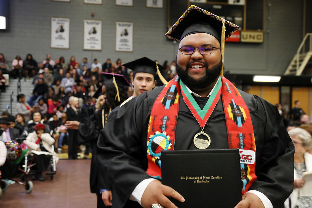 Harvey Maynor is all smiles after receiving his degree at UNCP on Saturday.