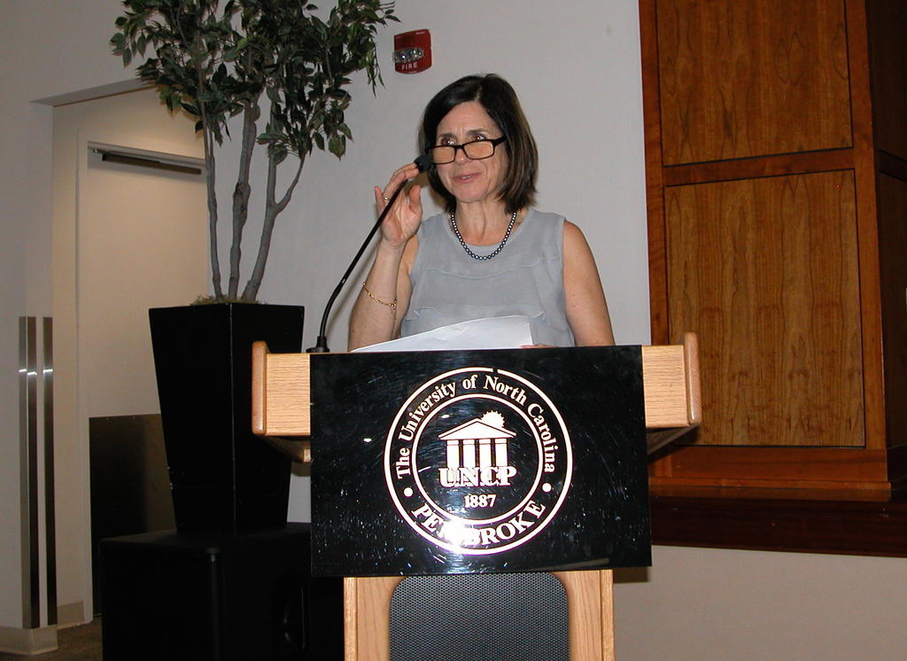 Dr. Maria Santisteban announcing the Biology Department awards
