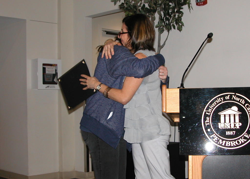 Cora Bright receiving the Biology Faculty GPA Award from Dr. Maria Santisteban