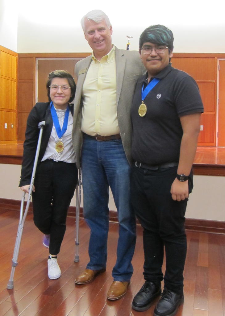 Brenda Dimas and Gerardo Cristobal were first place winners in the High School division at the Region iV Science Fair, and are seen here posing with Dr. Jeff Frederick
