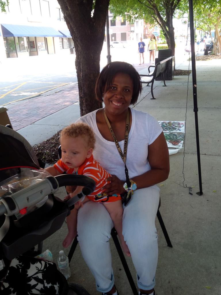 Nicole  Beverly, Department Administrative Associate enjoying the festvites with her son Christian