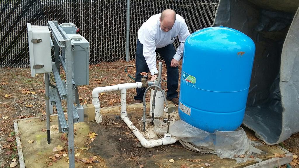 Dr Nelson at one of the off-campus wells for the Groundwater Project