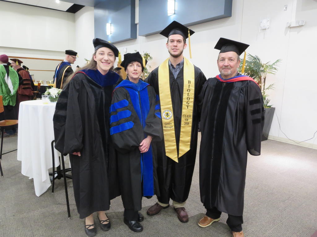 New graduate Grant Wood and Biology Professors Drs. Kaitlin Campbell, Lisa Kelly, and Leon Jernigan