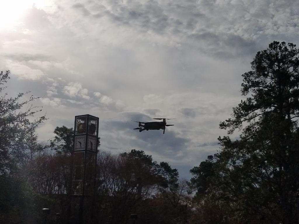 Image of quadcopter over campus