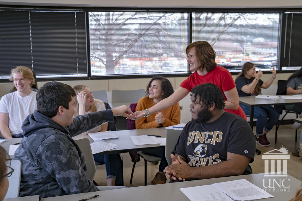 Dr. Jamie Mize interacts with students in class