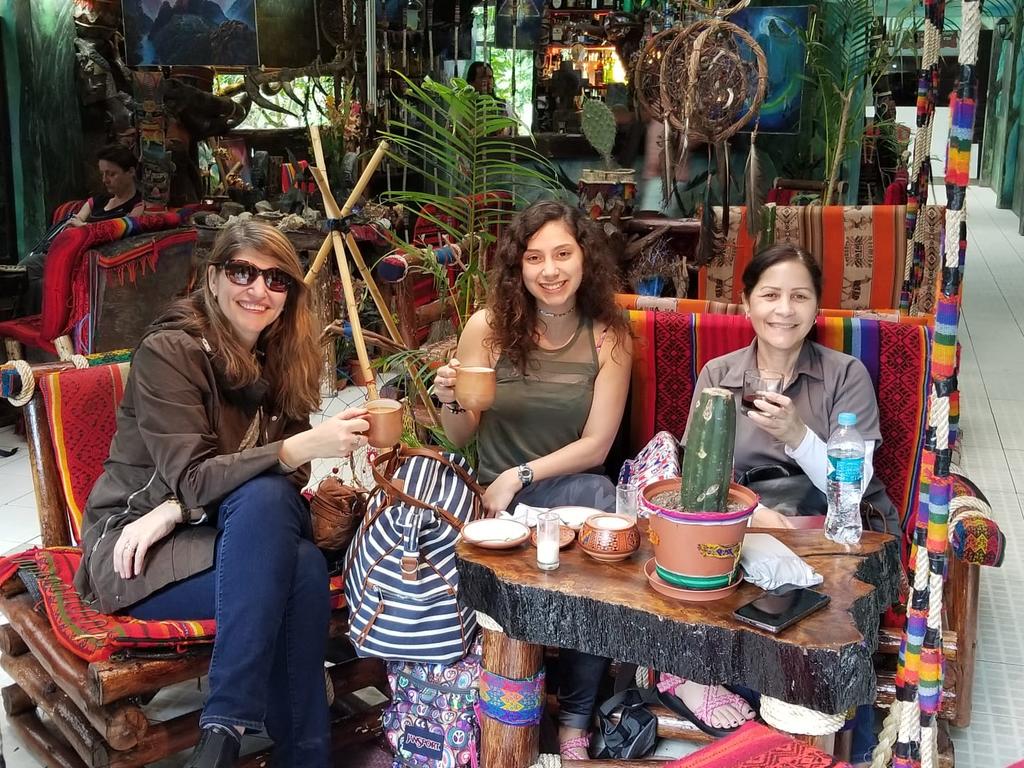 World Languages Program faculty Dr. Ana Cecilia Lara (left) and Professor Milagros López-Fred (right) enjoy a beverage with student Sarah Rodriguez (center) during a spring break trip to Peru.